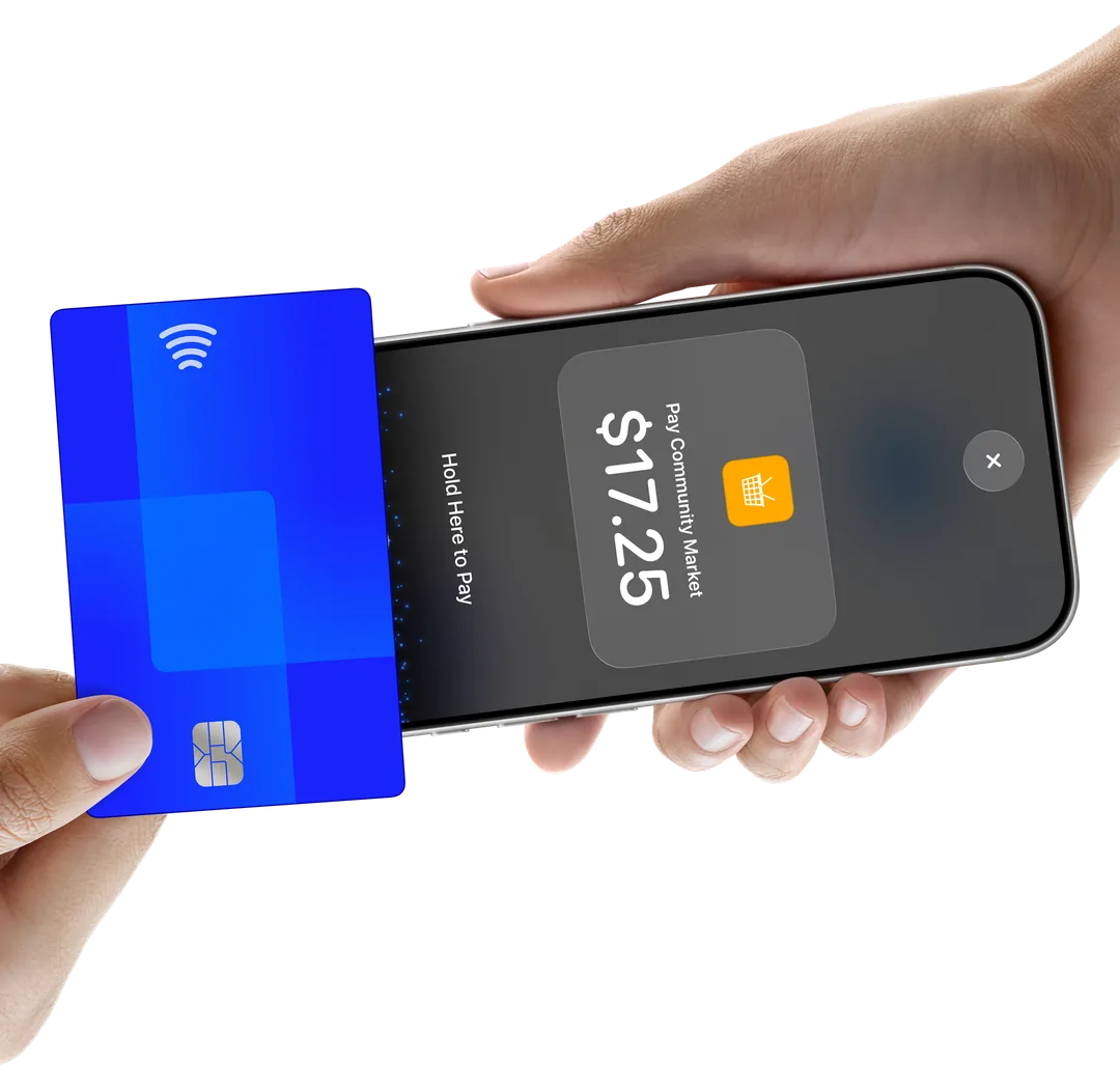 A customer holds a contactless card to an iPhone to pay with Tap to Pay on iPhone